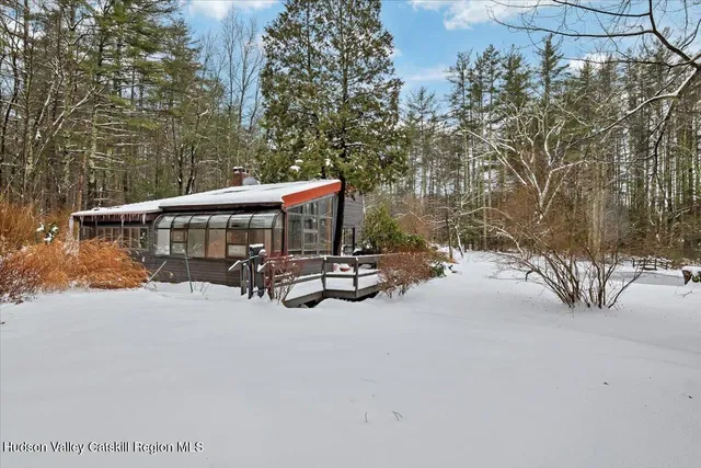 a view of a patio with table and chairs and couches