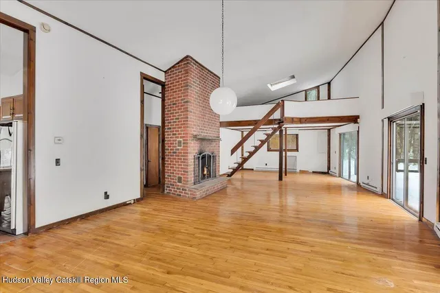 a view of an empty room with stairs