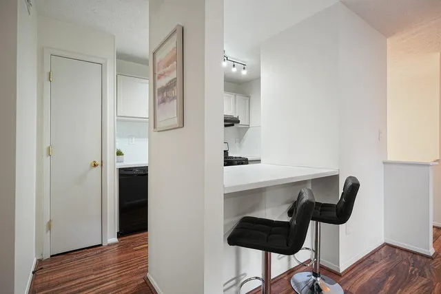 a view of kitchen with furniture and wooden floor