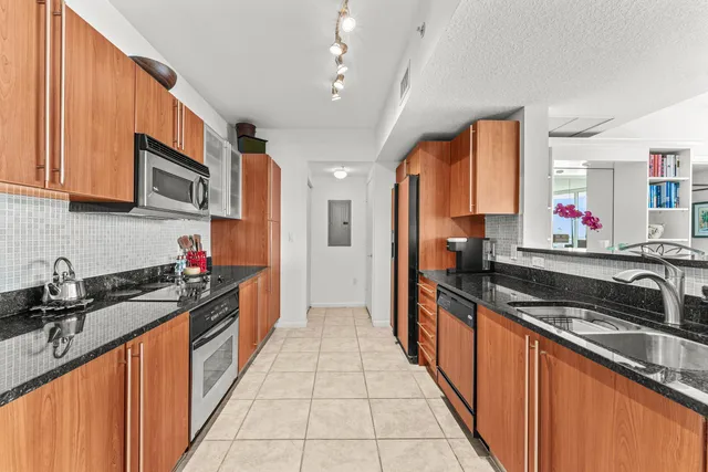 a bedroom with a bed and a potted plant
