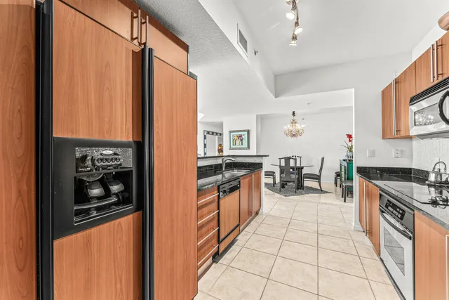 a bathroom with a granite countertop sink mirror bathtub and shower