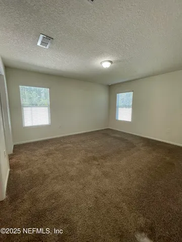 en empty room with windows