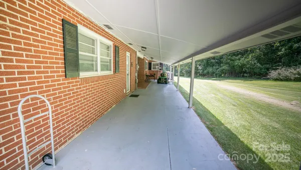 a view of a pathway with a backyard