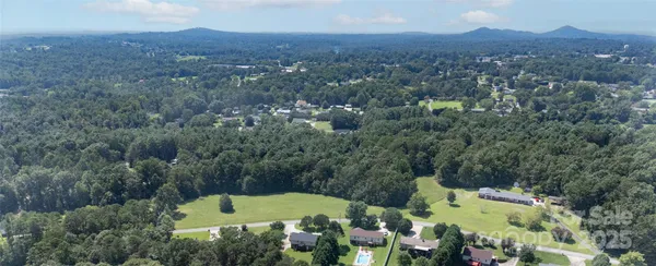 an aerial view of a house with a garden
