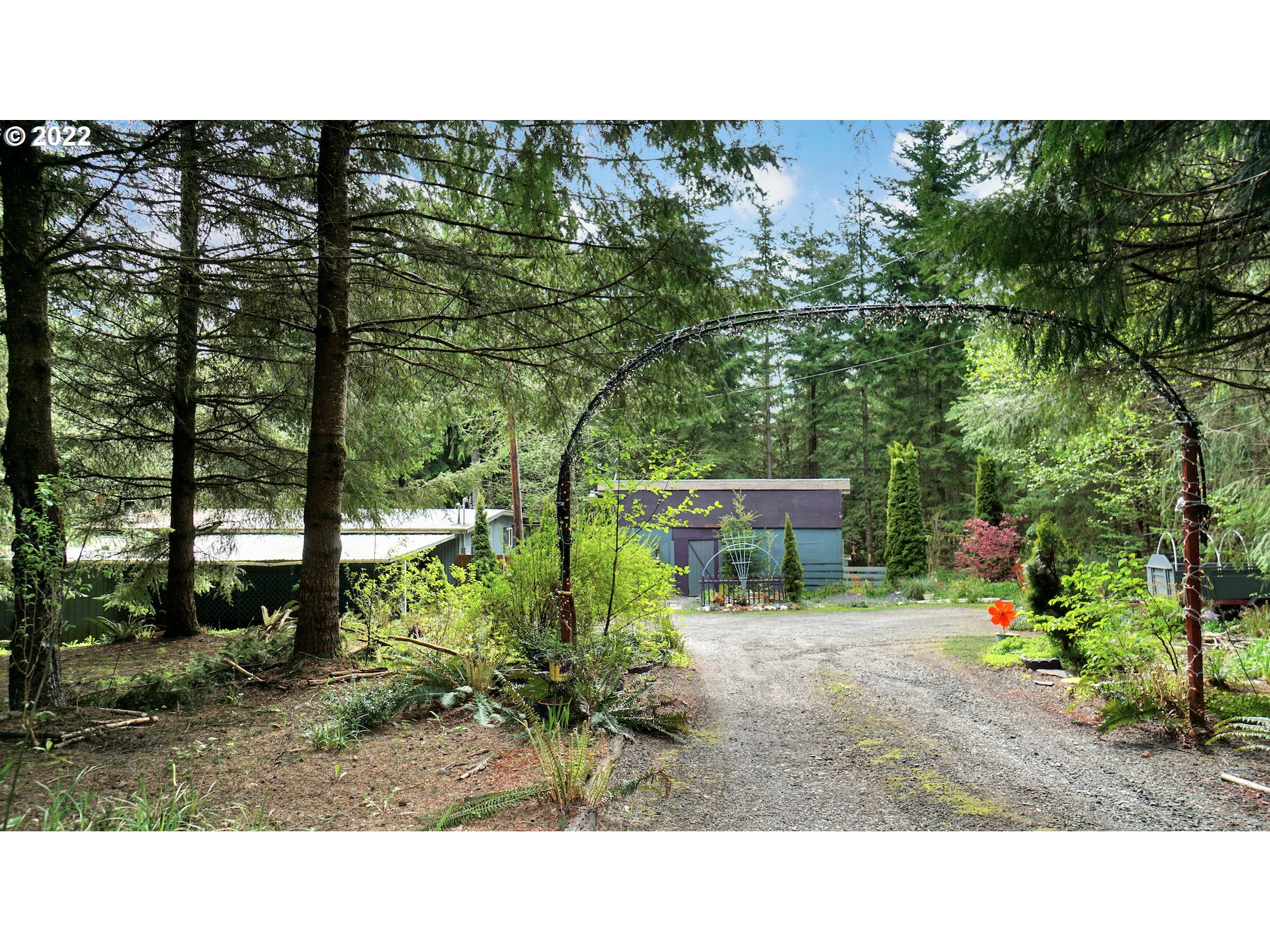 29191 Thistle Hill Road Rainier, OR 97048 - Photo 1 of 14 a picture of a bench in a garden