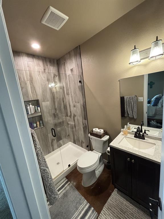 1020 Turkey Meadows Weatherford, TX 76088 - Photo 12 of 21 Ensuite bathroom with a shower stall, vanity, concrete flooring, and recessed lighting