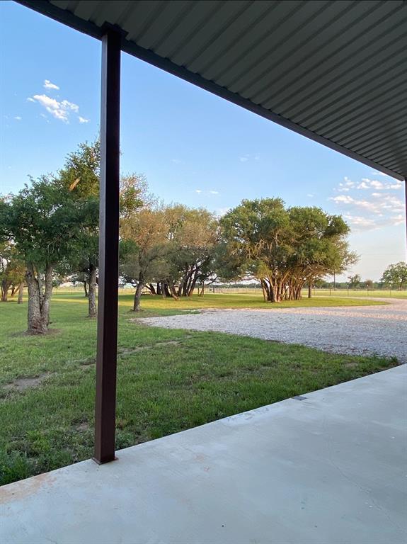 1020 Turkey Meadows Weatherford, TX 76088 - Photo 4 of 21 View of green lawn with a patio