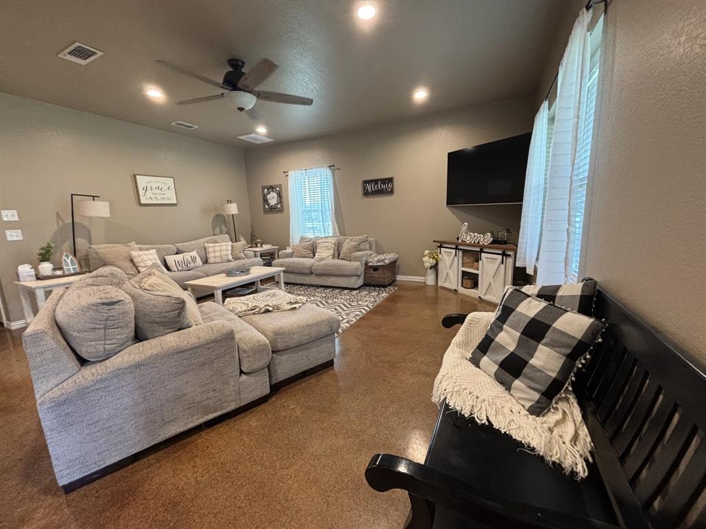1020 Turkey Meadows Weatherford, TX 76088 - Photo 8 of 21 Living area featuring ceiling fan and recessed lighting