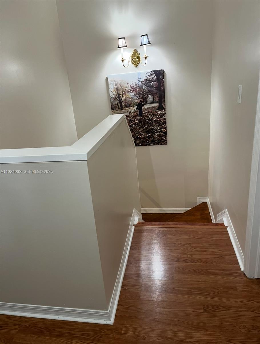 10150 Southwest 88th Street, Unit 103 Miami, FL 33176 - Photo 16 of 29 a view of entryway with wooden floor