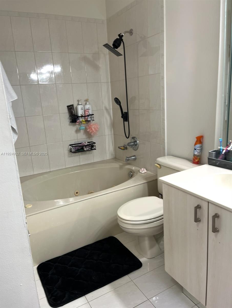 10150 Southwest 88th Street, Unit 103 Miami, FL 33176 - Photo 23 of 29 a bathroom with a sink a toilet and shower