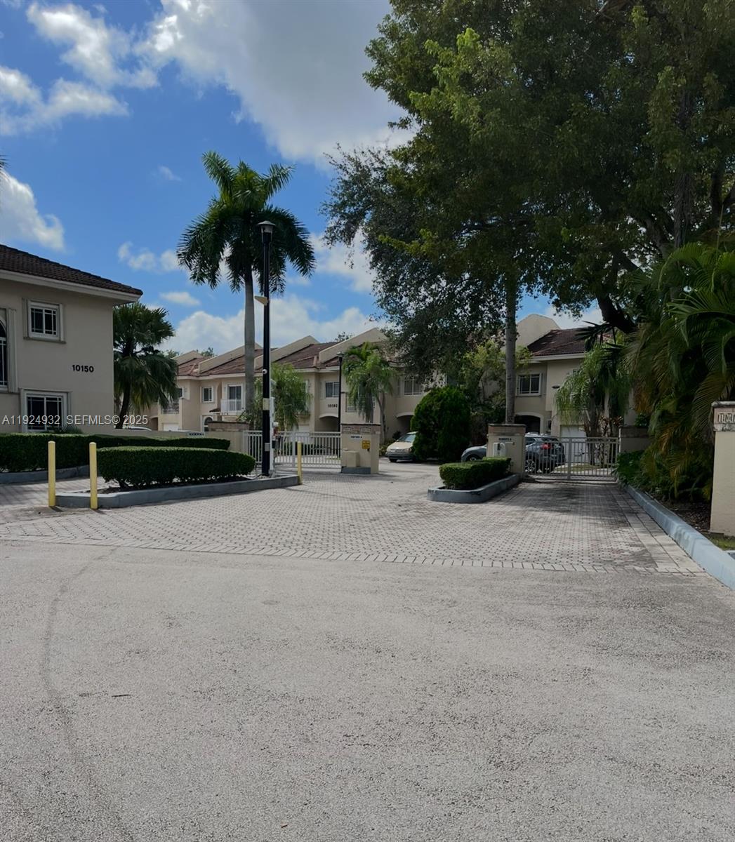 10150 Southwest 88th Street, Unit 103 Miami, FL 33176 - Photo 28 of 29 a view of a street with a building in the background