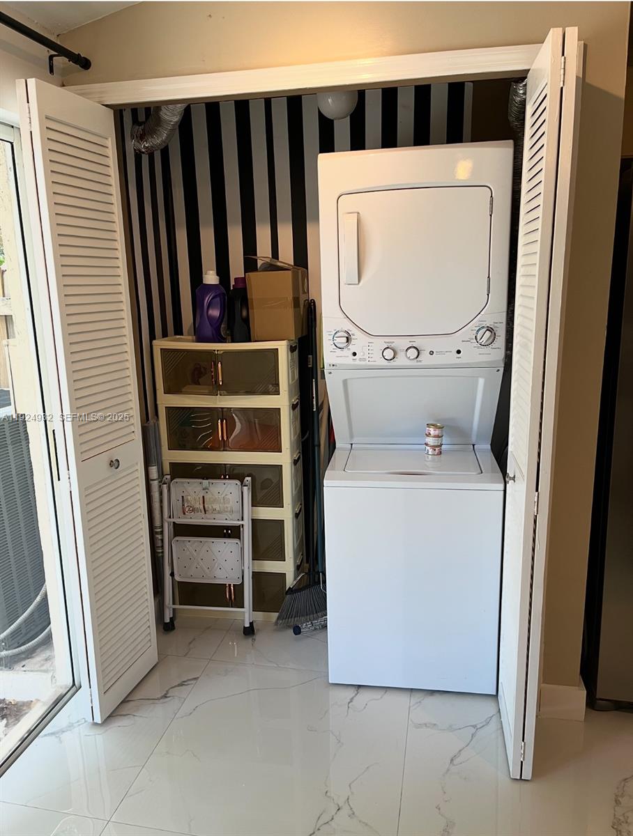 10150 Southwest 88th Street, Unit 103 Miami, FL 33176 - Photo 5 of 29 a utility room with dryer and washer