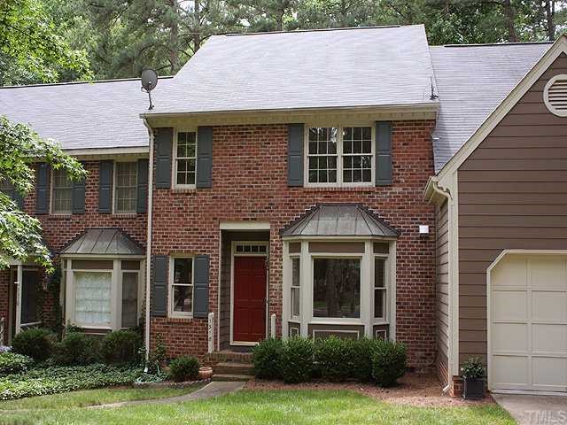 1318 Slatestone Court Raleigh, NC 27615 - Photo 1 of 12 a front view of a house with garden