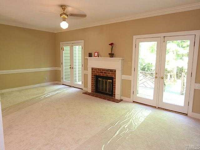 1318 Slatestone Court Raleigh, NC 27615 - Photo 2 of 12 a view of empty room with a fireplace