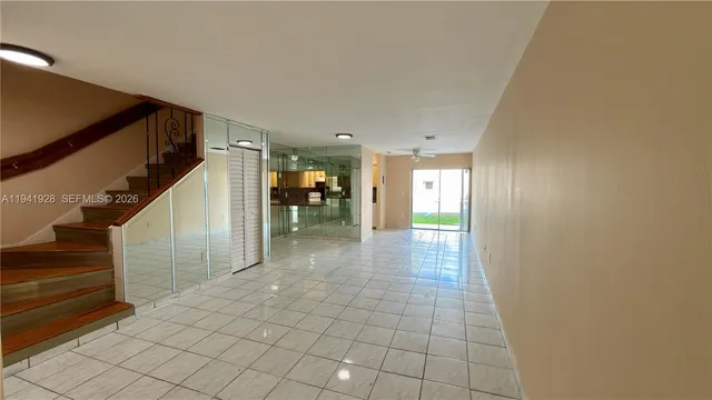 a bathroom with a glass door shower and a sink