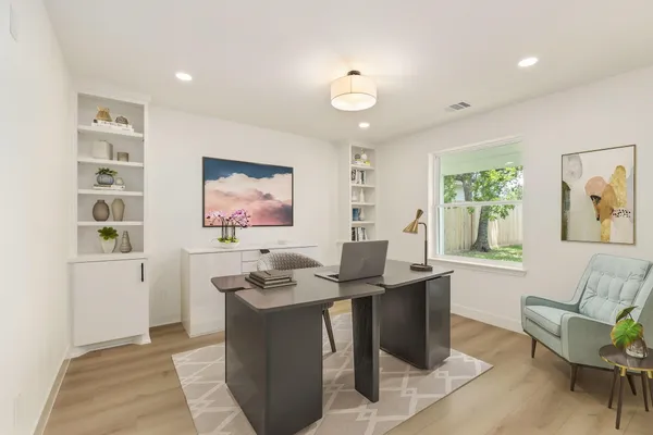 a view of a livingroom with furniture and window