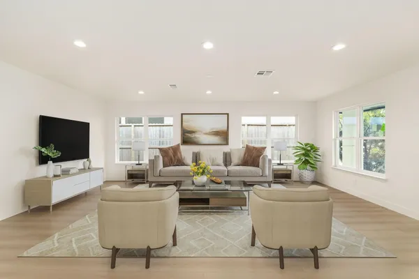 a living room with fireplace furniture and a flat screen tv