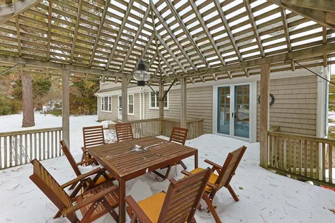 a view of a patio with a table and chairs