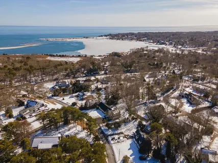 an aerial view of residential building and ocean