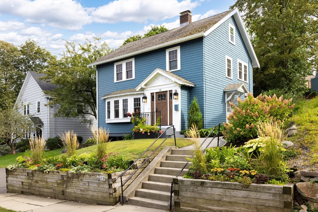 18 Wolcott Road Brookline, MA 02467 - Photo 1 of 19 a front view of a house with a yard