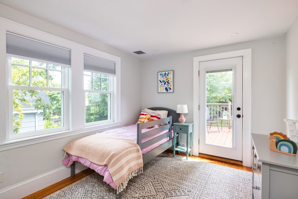 18 Wolcott Road Brookline, MA 02467 - Photo 12 of 19 a bedroom with a bed and a window