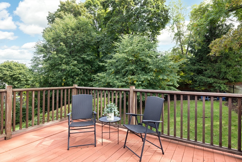 18 Wolcott Road Brookline, MA 02467 - Photo 17 of 19 a view of balcony with wooden floor and outdoor seating