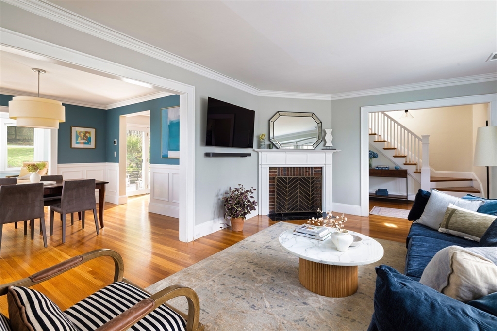 18 Wolcott Road Brookline, MA 02467 - Photo 3 of 19 a living room with furniture a fireplace and a flat screen tv