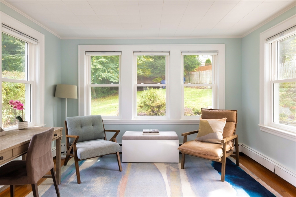 18 Wolcott Road Brookline, MA 02467 - Photo 8 of 19 a living room with furniture and a window with wooden floor