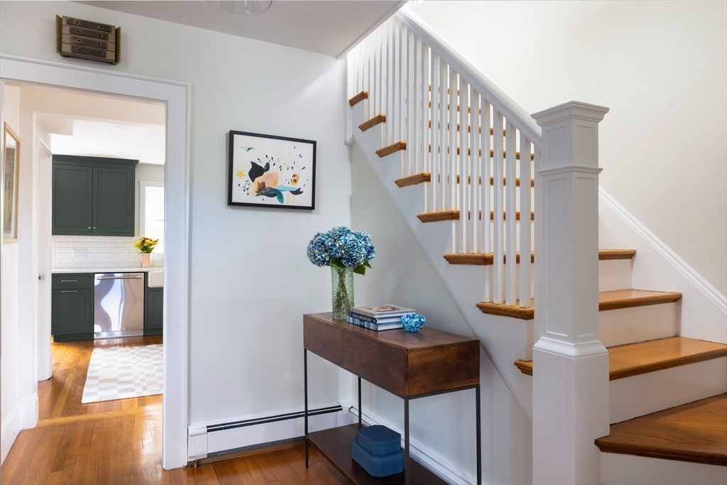 18 Wolcott Road Brookline, MA 02467 - Photo 9 of 19 a living room with furniture and a potted plant