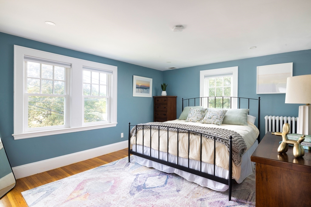 18 Wolcott Road Brookline, MA 02467 - Photo 10 of 19 a bed sitting in a bedroom next to a window