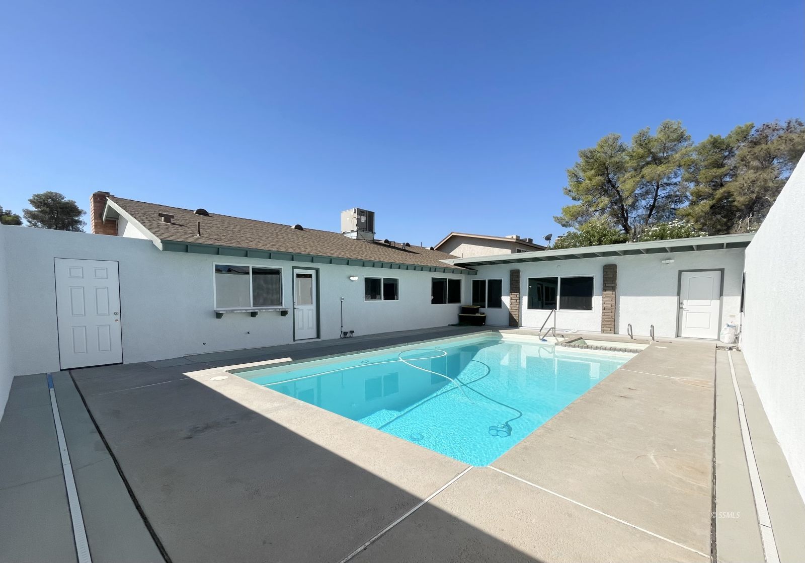 1031 North Sierra View Street Ridgecrest, CA 93555 - Photo 29 of 33 a front view of a house with a yard