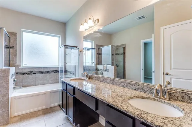 a bathroom with a shower and a bathtub