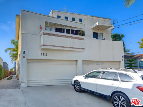 a front view of a house with parking
