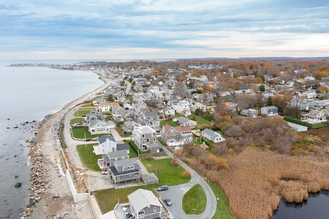 an aerial view of a residential houses with outdoor space