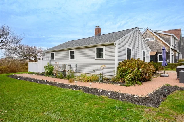 a view of a house with a yard and plants