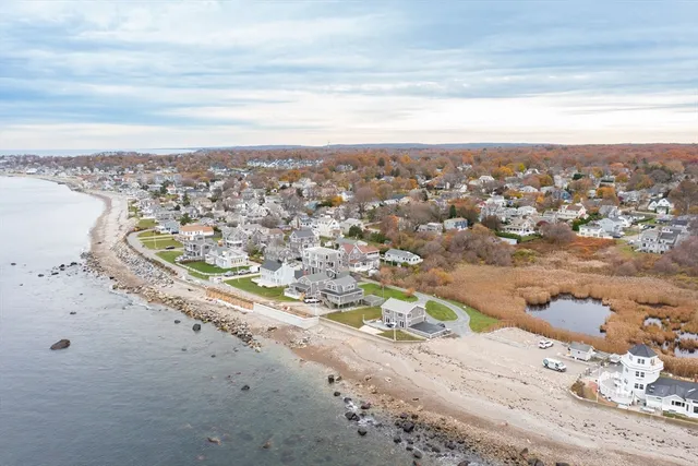 an aerial view of beach and city