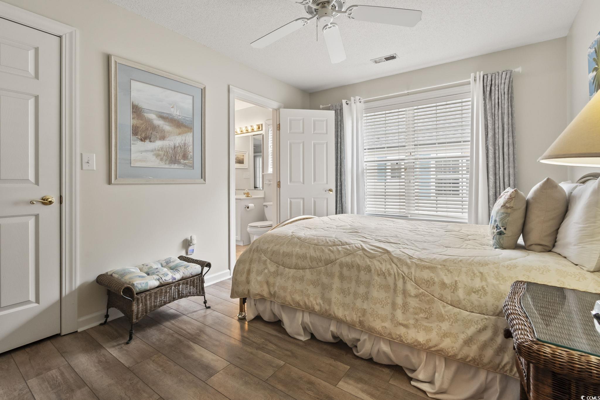 9683 Glenn Ellen Way Myrtle Beach, SC 29572 - Photo 14 of 35 Bedroom with a textured ceiling, a closet, carpet floors, and ceiling fan