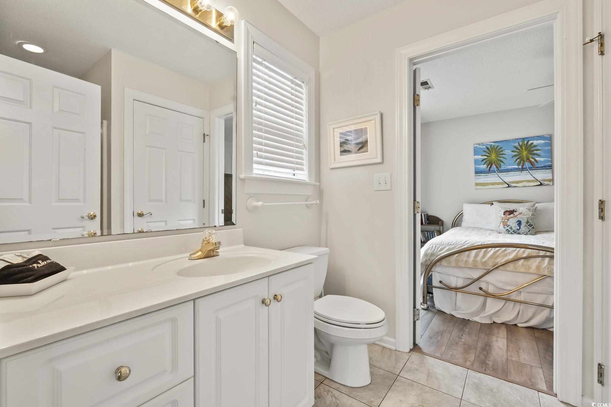 9683 Glenn Ellen Way Myrtle Beach, SC 29572 - Photo 16 of 35 Bathroom with vanity, ensuite bath, and a shower with shower curtain