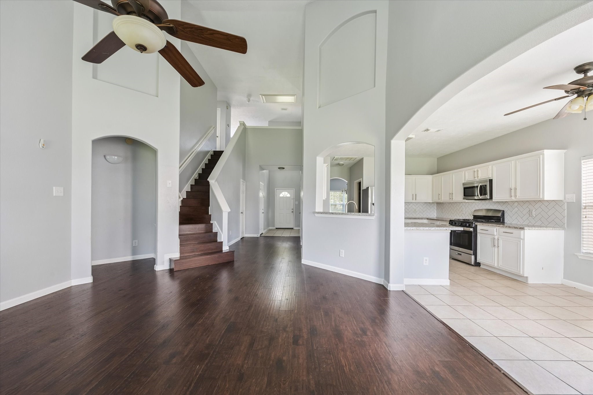 18239 Eton Ridge Court Richmond, TX 77407 - Photo 4 of 10 a view of a living room with wooden floor