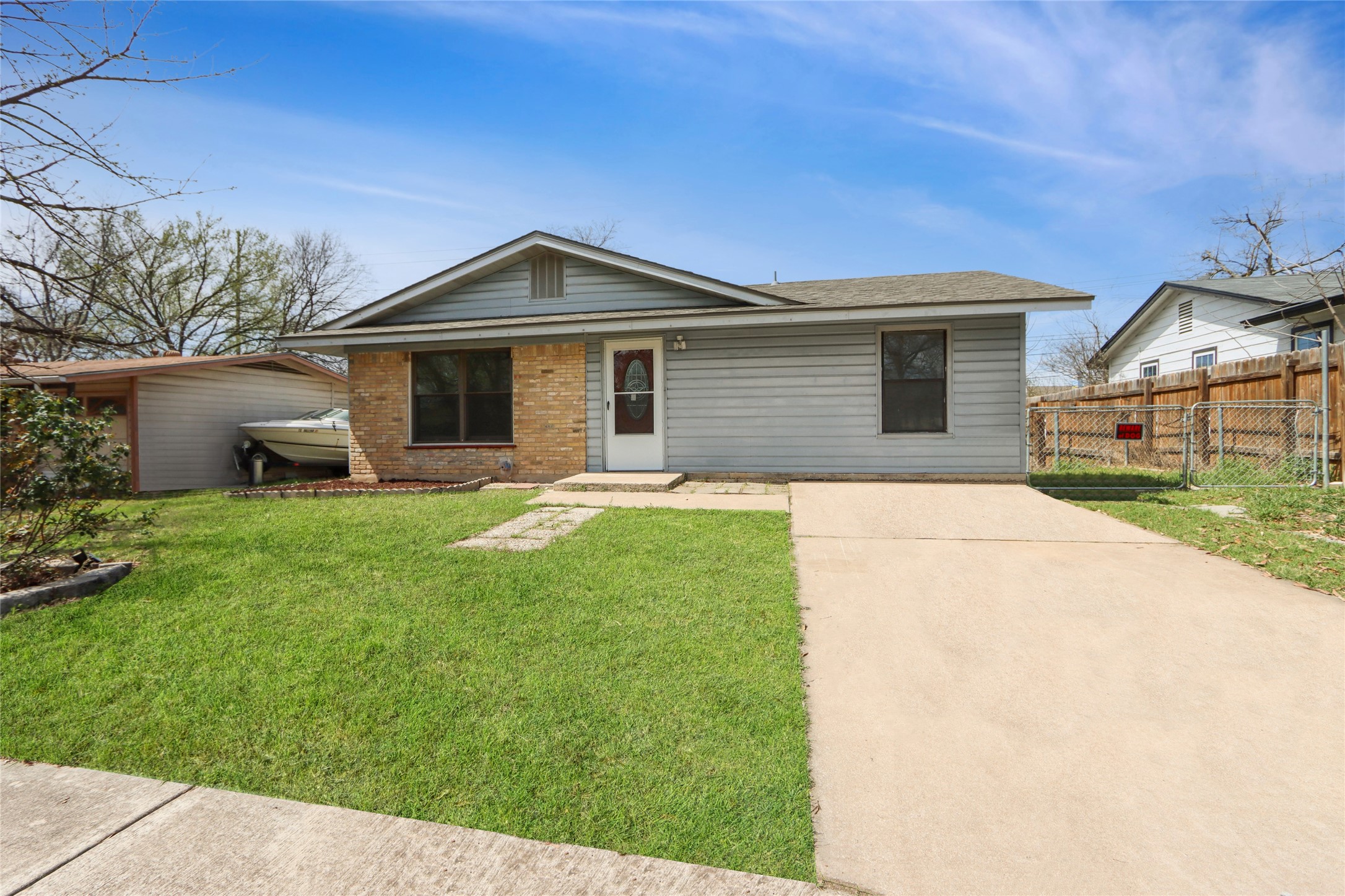 9100 Shepard Drive Austin, TX 78753 - Photo 1 of 26 a front view of a house with yard and green space