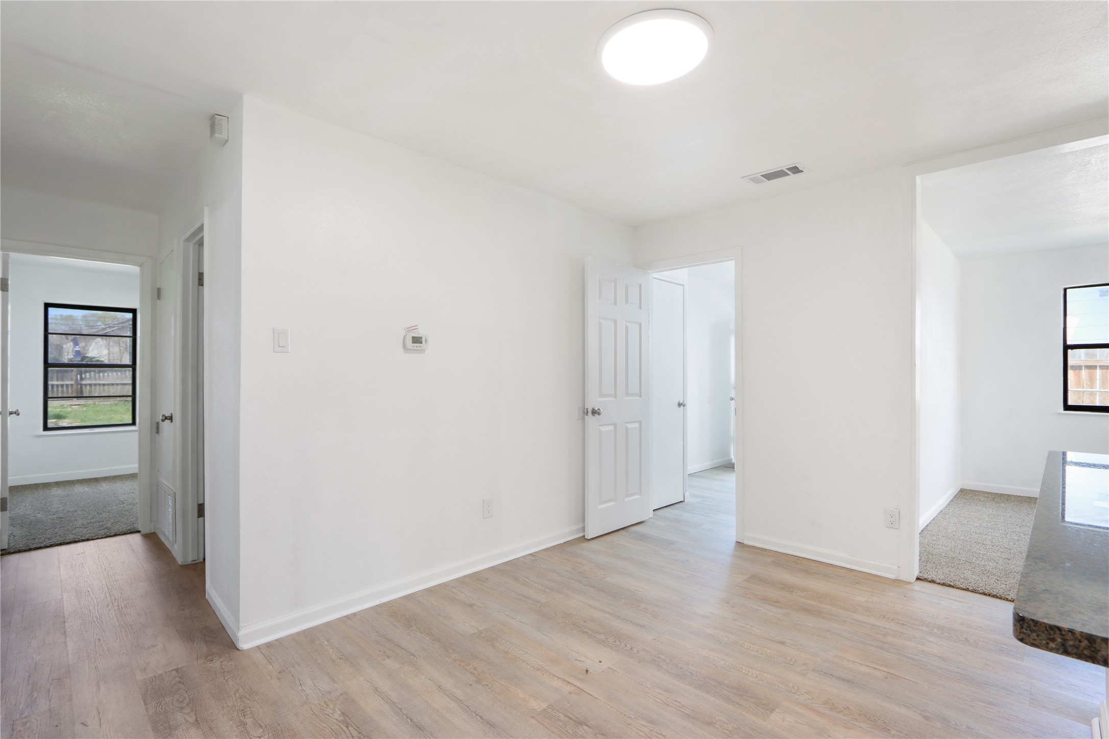 9100 Shepard Drive Austin, TX 78753 - Photo 11 of 26 a view of livingroom with hardwood floor and a couch