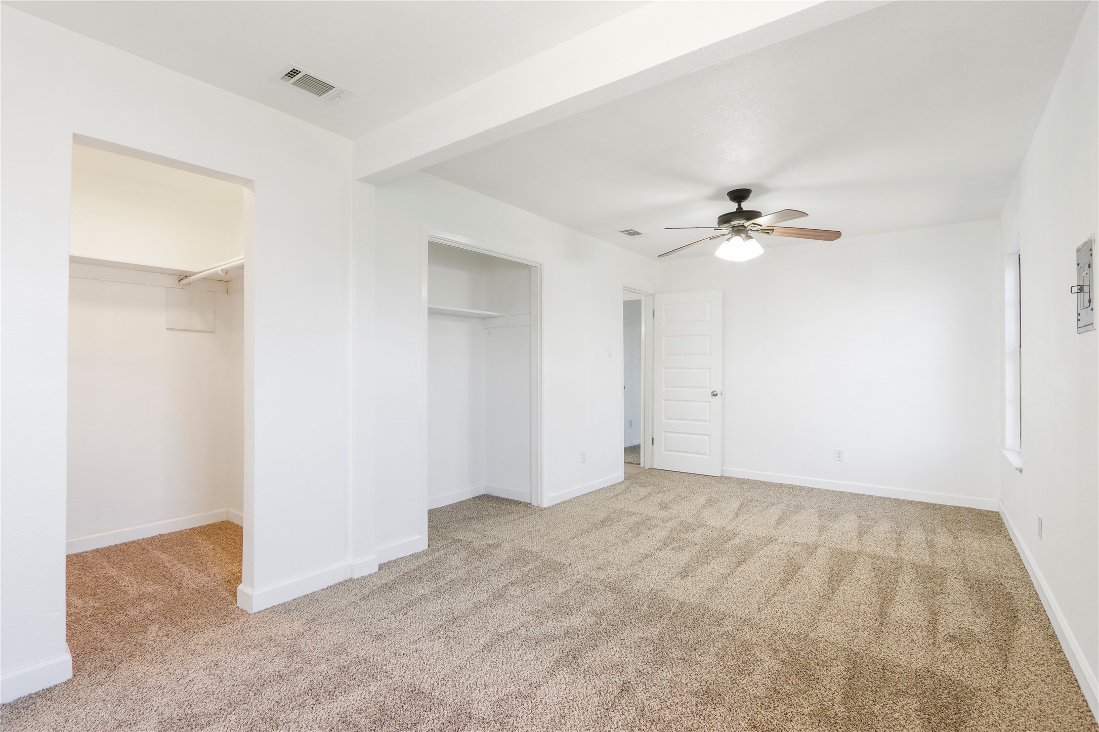 9100 Shepard Drive Austin, TX 78753 - Photo 22 of 26 a view of an empty room with a chandelier fan