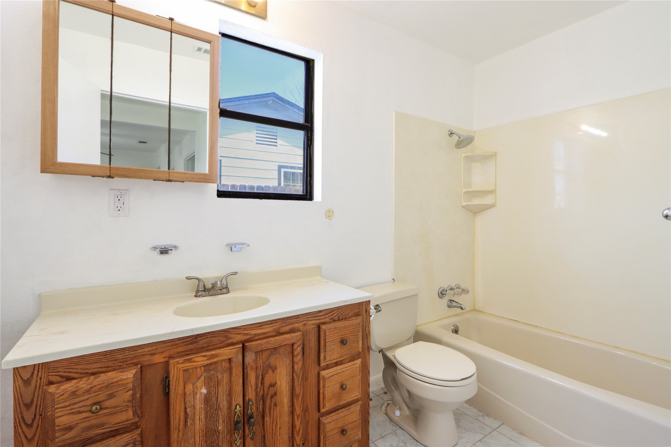 9100 Shepard Drive Austin, TX 78753 - Photo 23 of 26 a bathroom with a sink a toilet and shower