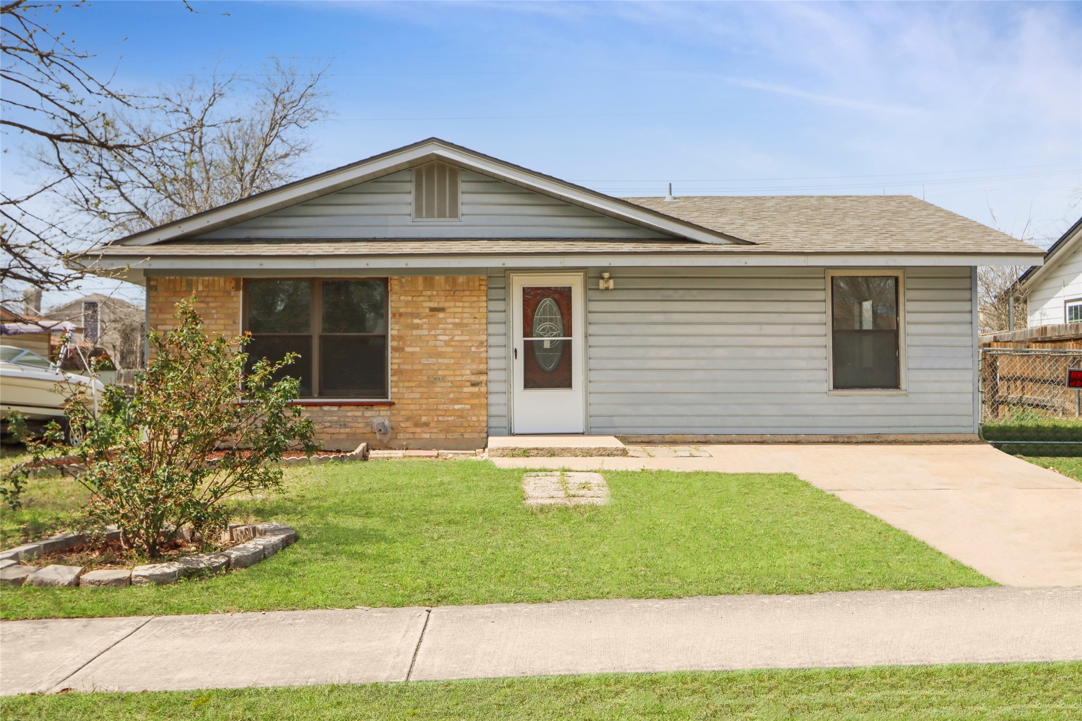 9100 Shepard Drive Austin, TX 78753 - Photo 24 of 26 a front view of a house with a yard