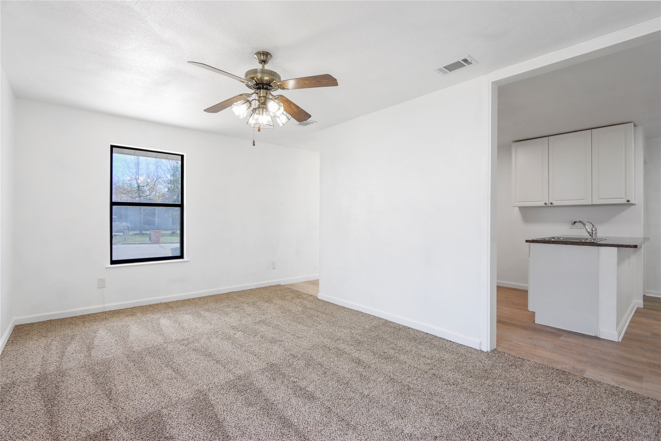 9100 Shepard Drive Austin, TX 78753 - Photo 6 of 26 wooden floor in an empty room with a window