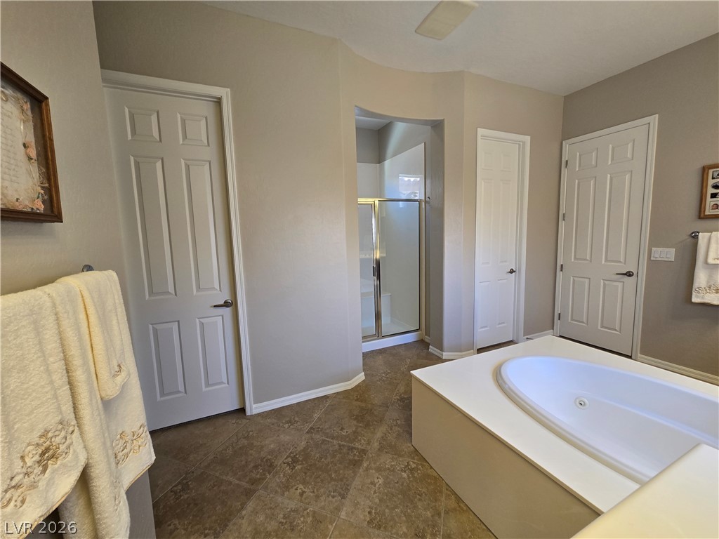 2567 Dirleton Place Henderson, NV 89044 - Photo 39 of 67 Indulge in a deep soaking tub and a spacious walk-in shower for ultimate relaxation.