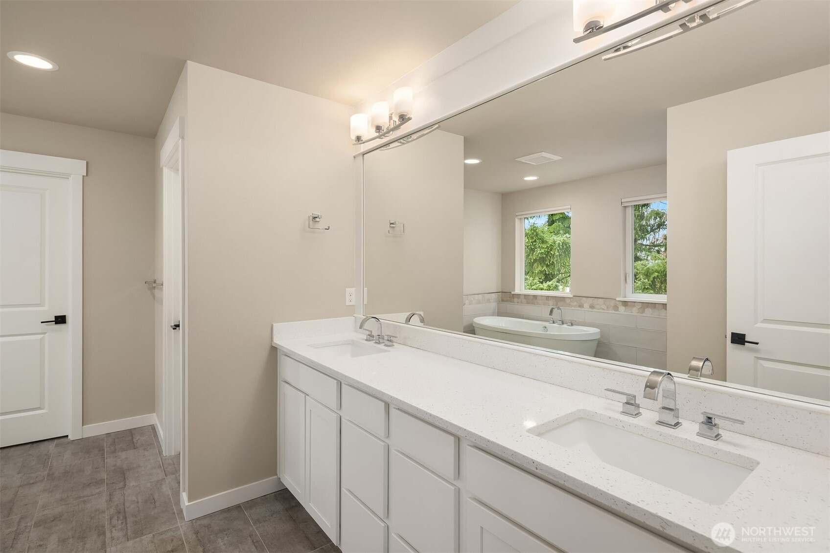 1435 242nd Place Southeast Bothell, WA 98021 - Photo 28 of 40 a bathroom with a sink and a mirror