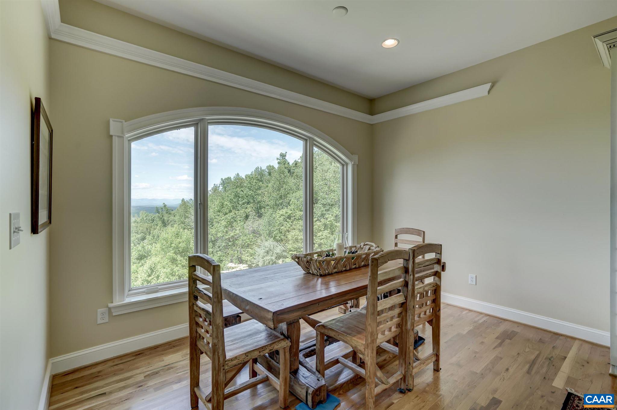 2545 Summit Ridge Trail Charlottesville, VA 22911 - Photo 19 of 47 a view of a dining room with furniture window and wooden floor