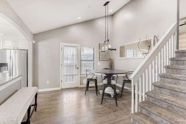 a view of a livingroom with furniture and hardwood floor