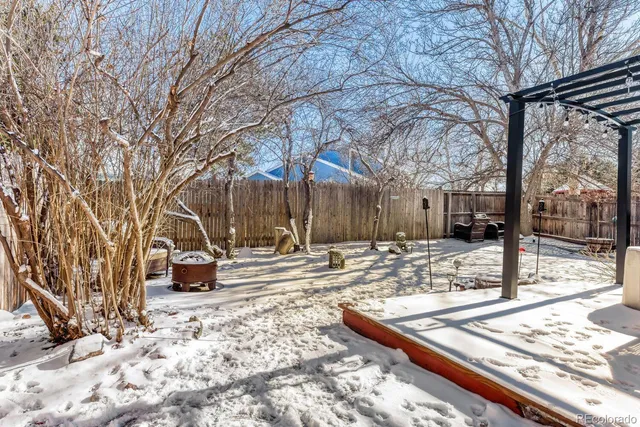 a view of a backyard with sitting area